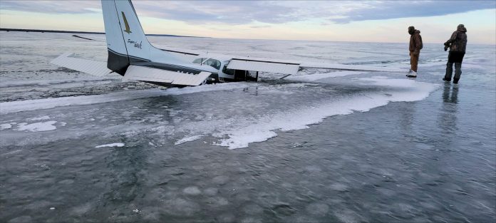 This Dec. 19, 2023 photo provided by the Beltrami County Sheriff's Office in Minnesota shows a plane that fell through ice on Upper Red Lake in Washkish, Minn.