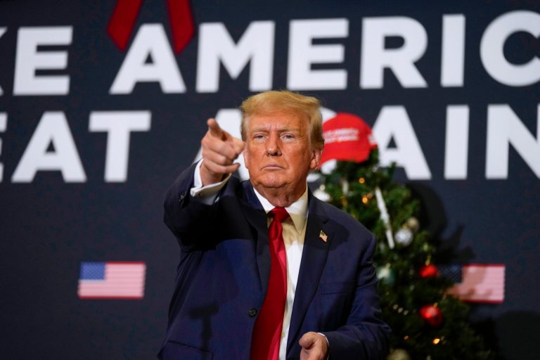 Former President Donald Trump points to supporters during a rally on Dec. 19, 2023, in Waterloo, Iowa. 