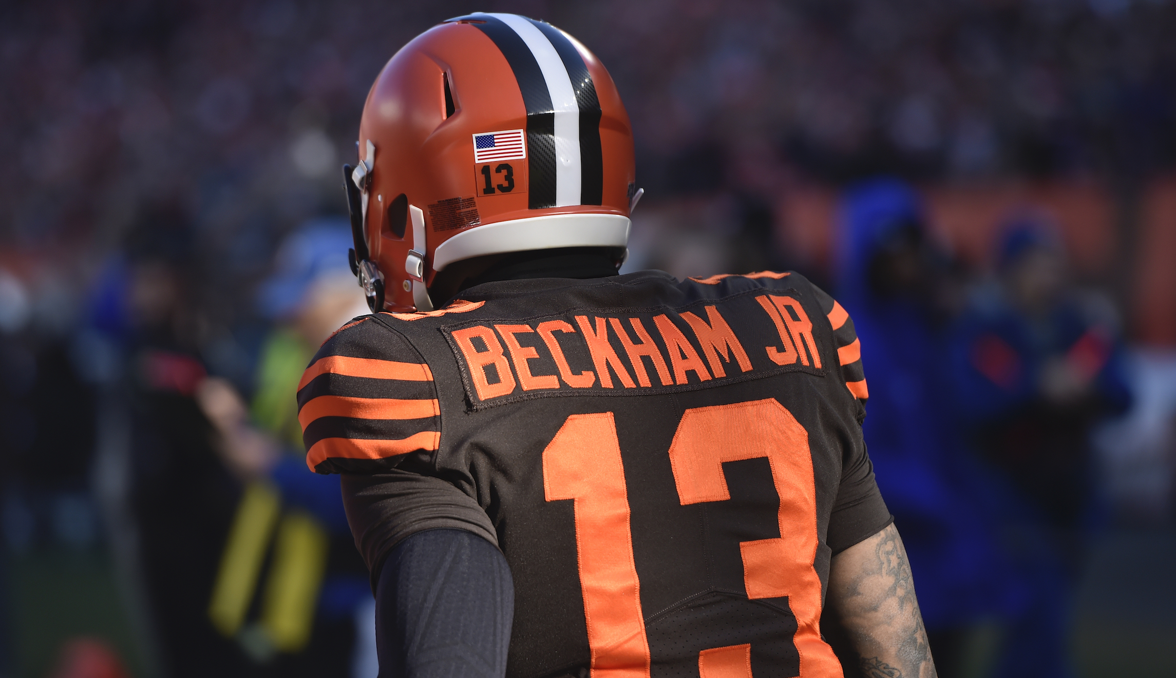 VIDEO: NFL star slapped with arrest warrant after spanking police officer on the rear