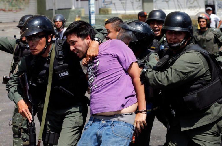 2 dead as Venezuelans clash at protest barricades