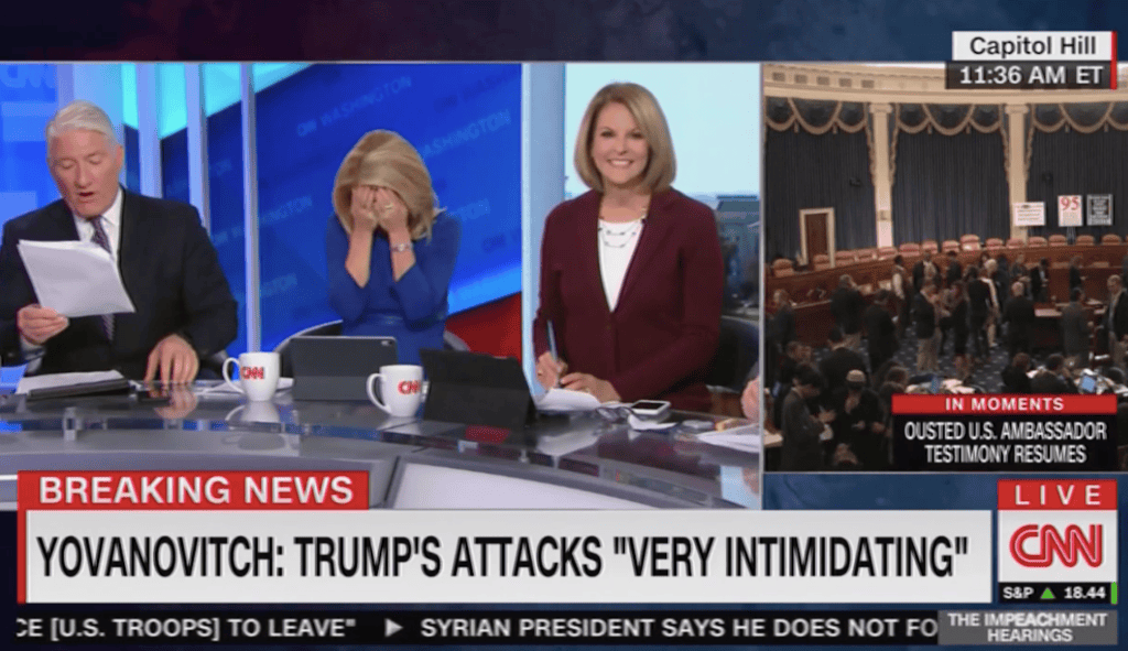 WATCH: CNN correspondent buries face in hands during reading of Trump call transcript