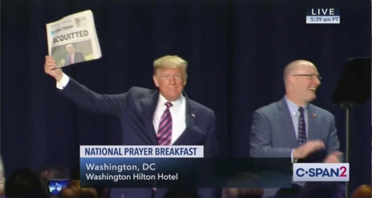 ‘ACQUITTED’: Trump showcases post-impeachment front pages during National Prayer Breakfast