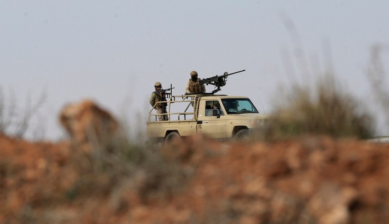 FILE - Jordanian soldiers patrol near the eastern Jordan-Syria border, in al-Washash, Mafraq governorate, Jordan, on Feb. 17, 2022, during media tour organised by the Jordanian army. An airstrike on southern Syria early Thursday Jan. 18, 2024 killed at least nine people and was probably carried out by Jordan's air force, Syrian opposition activists said, the latest in a series of strikes in an area where cross-border drug smugglers have been active. (AP Photo/Raad Adayleh, File)