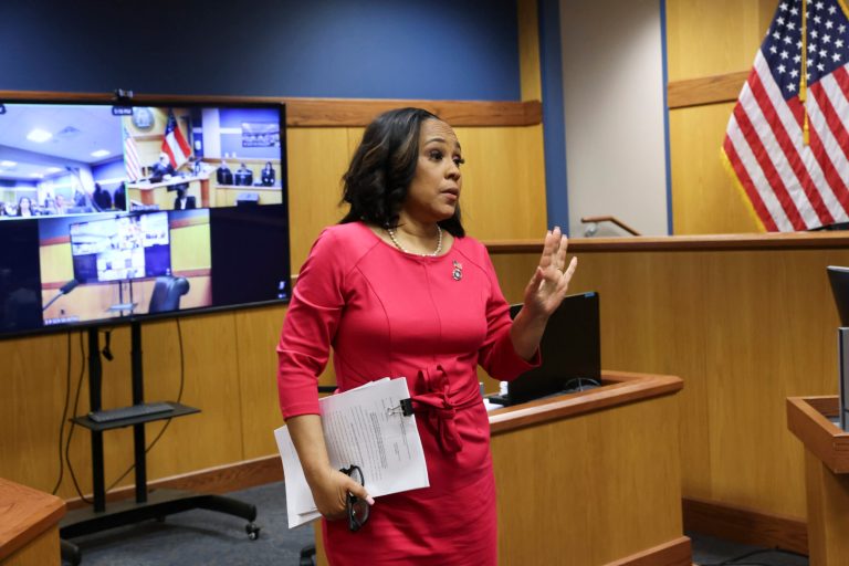 Fulton County District Attorney Fani Willis steps away from the stand after testifying during a hearing on the Georgia election interference case, Thursday, Feb. 15, 2024, in Atlanta. The hearing is to determine whether Willis should be removed from the case because of a relationship with Nathan Wade, special prosecutor she hired in the election interference case against former President Donald Trump. (Alyssa Pointer/Pool Photo via AP)