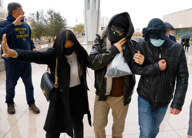 Former FBI informant Alexander Smirnov, second from right, leaves the courthouse on Tuesday, Feb. 20, 2024, in Las Vegas. Prosecutors say that Smirnov, who is charged with making up a multimillion-dollar bribery scheme involving President Joe Biden, his son Hunter and a Ukrainian energy company, had contacts with Russian intelligence-affiliated officials. (Bizuayehu Tesfaye/Las Vegas Review-Journal via AP)