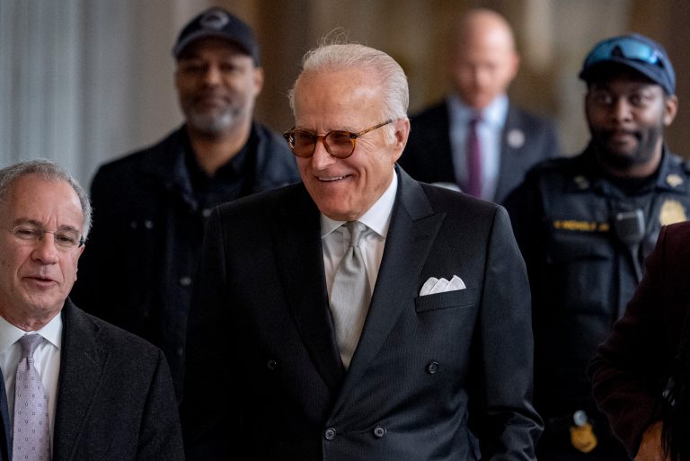 James Biden, brother of President Joe Biden, accompanied by Attorney Paul Fishman, left, arrives for a private interview with House Republicans at Thomas P. O'Neill House Office Building on Capitol Hill in Washington, Wednesday, Feb. 21, 2024. (AP Photo/Andrew Harnik)
