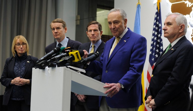 Left to right: Sen. Maggie Hassan (D-NH), Sen. Michael Bennet (D-CO), Sen. Richard Blumenthal (D-CT), Charles Schumer (D-NY), and Sen. Jack Reed (D-RI) answer media questions in Lviv, Ukraine, Friday, Feb. 23, 2024. (AP Photo/Mykola Tys)