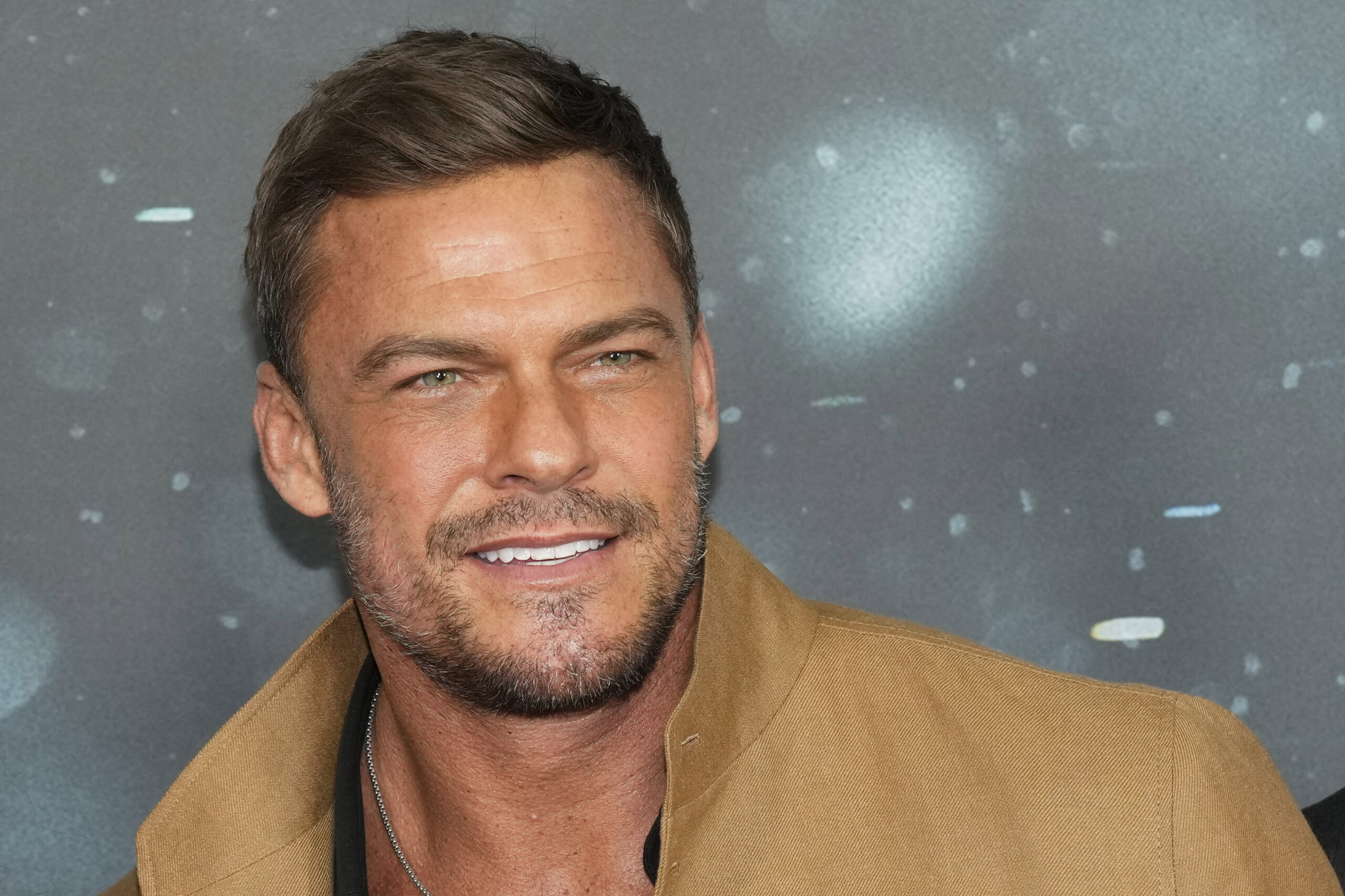 Reacher’s Alan Ritchson argues that message of Christianity is that ‘heaven is coming’ to Earth