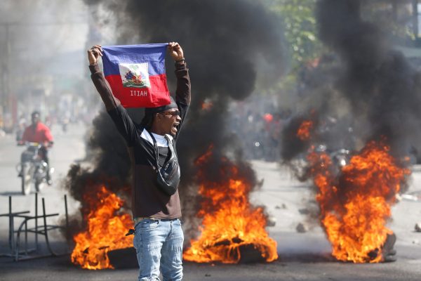 Haiti prison break: Thousands of inmates escape after armed gangs storm jails