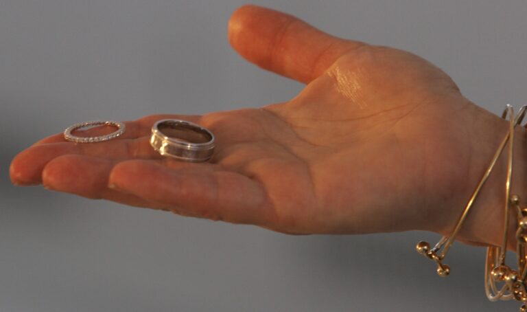A marriage official offers a couple their rings during their wedding at the Empire State Building in New York, Wednesday Feb. 14, 2007. Cheating on your spouse is illegal in New York — but the state might soon change that. A bill working its way through the New York Legislature could repeal a more than century old law that makes adultery a crime.