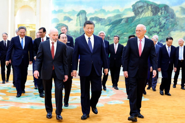 Xi Jinping woos Western businesses while spy agency airs warnings