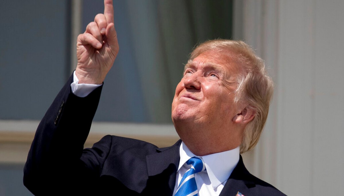 White House celebrates solar eclipse by reposting 2017 photo of Trump without eyewear
