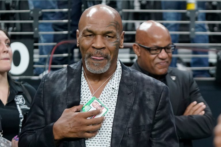 Former heavyweight boxing champion Mike Tyson stands on the field before an NFL football game between the Las Vegas Raiders and the Pittsburgh Steelers Sunday, Sept. 24, 2023, in Las Vegas.
