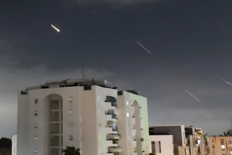 Israeli Iron Dome air defense system launches to intercept missiles.