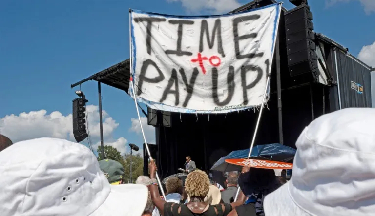 A sign at a Washington, D.C., reparations rally, on Aug. 26, 2023.