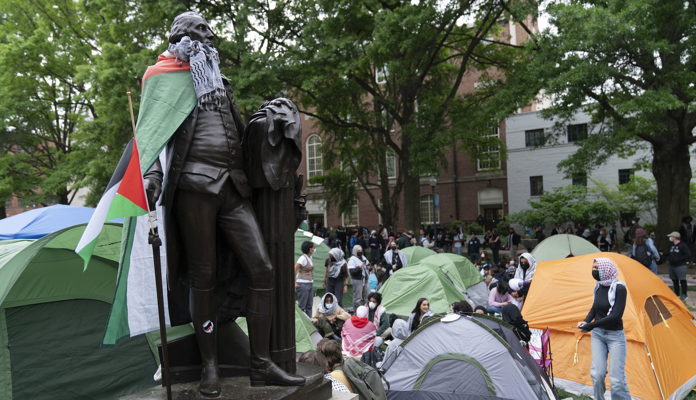 Protesters from several DC-area schools unite in large demonstration at GWU as faculty join in