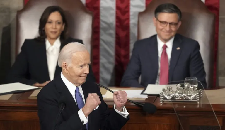 President Joe Biden gestures to Republicans as Vice President Kamala Harris and House Speaker Mike Johnson of La., watch during the State of the Union address to a joint session of Congress at the Capitol, March 7, 2024, in Washington. (AP Photo/Andrew Harnik)