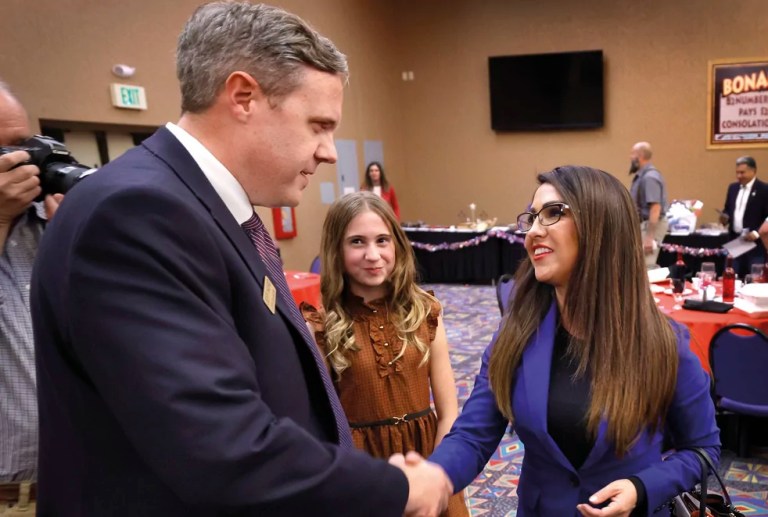 Rep. Lauren Boebert, R-Colo., shakes hands with Rep. Jeff Hurd of Grand Junction, Colo., on Saturday, Oct. 28, 2023. (AP Photo/Jerry McBride)