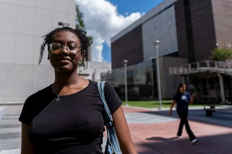 Anaya Bridges, a full-time student at Georgia State University, poses at the university's campus in Atlanta, Monday, July 22, 2024.