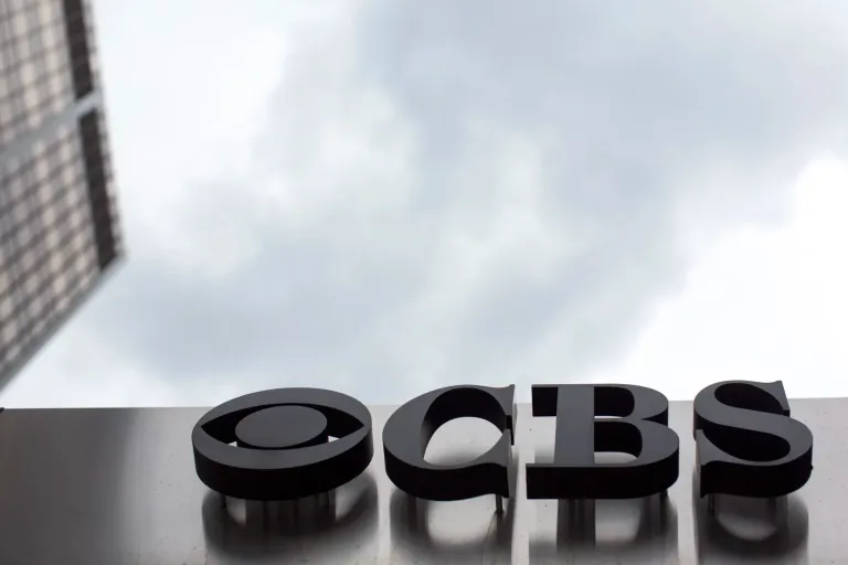 The CBS logo appears at its broadcast center in New York on May 10, 2017. CBS News has asked all of its local stations to become proficient in “solutions journalism,” a story-telling method that has taken off in the past decade to counter people who think reporters are obsessed with bad news.