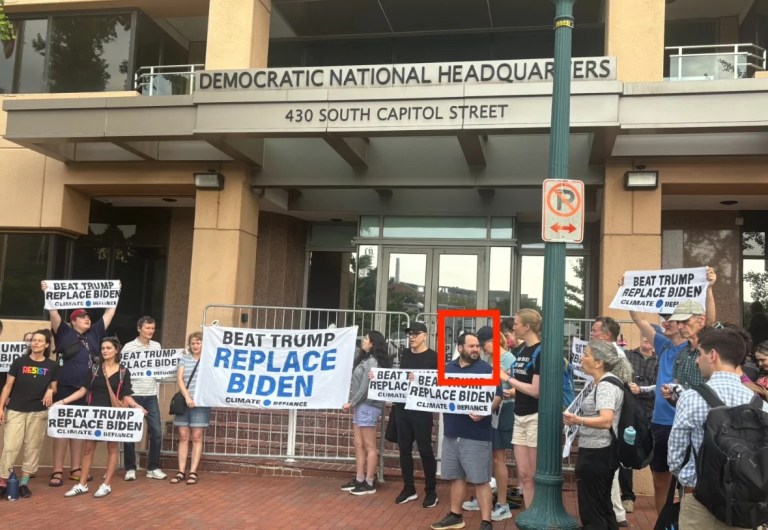 Federal official protests with disruptive climate group against Biden outside DNC