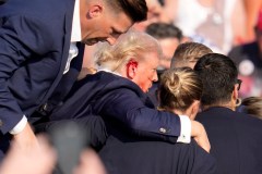 Trump evacuated from rally after shots fired in apparent assassination attempt