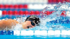 U.S. swimmer wins gold and sets Olympic record