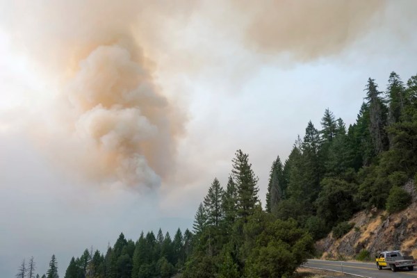 Firefighters helped by cooler weather battle blaze that has scorched area larger than Los Angeles