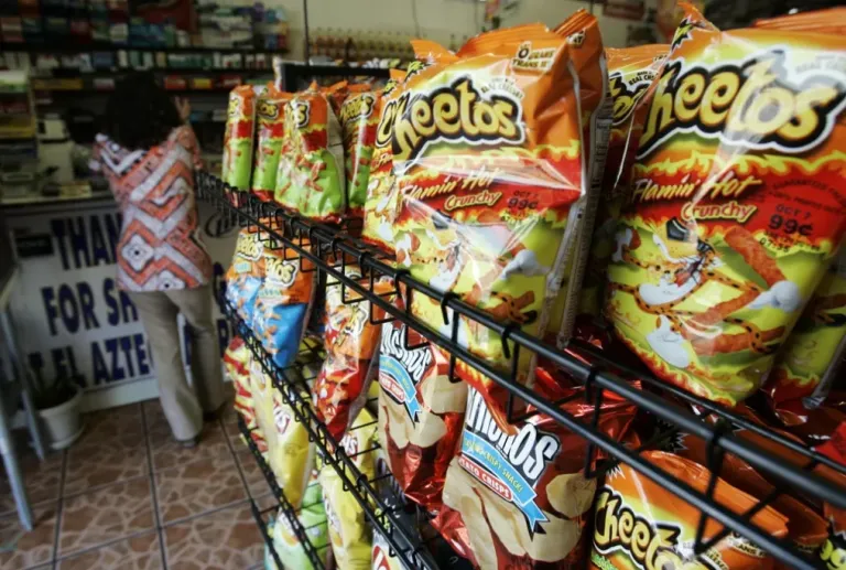 Flamin' Hot Cheetos stock the shelves of a market.