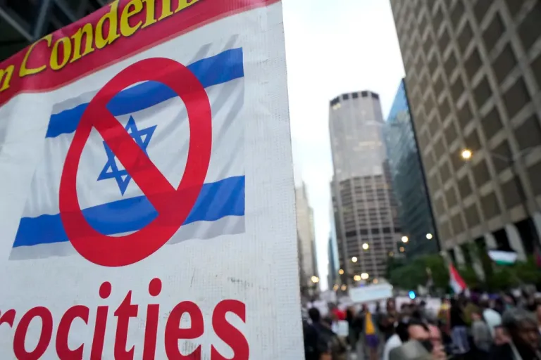 Protesters demonstrate near the Israeli Consulate during the Democratic National Convention Tuesday, Aug. 20, 2024, in Chicago. (AP Photo/Julio Cortez)