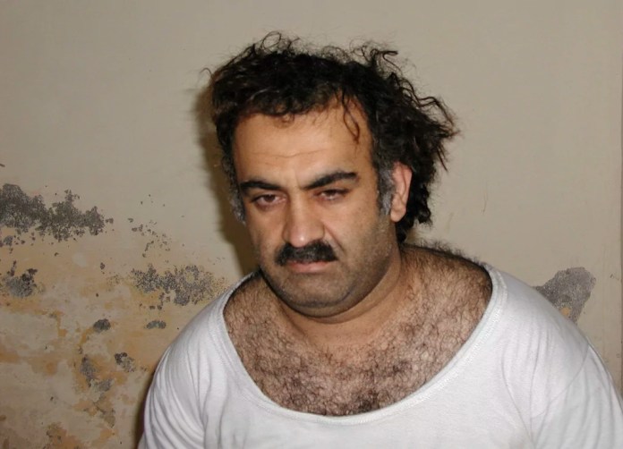 Khalid Sheikh Mohammed, the alleged 9/11 mastermind, is seen shortly after his capture during a raid in Pakistan, Saturday March 1, 2003, in this photo obtained by the "Associated Press." The man accused of being the main plotter in al Qaeda's Sept. 11, 2001, attacks has agreed to plead guilty, the Defense Department said Wednesday.