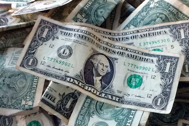 Dollar bills are shown in New York, Oct. 24, 2016.