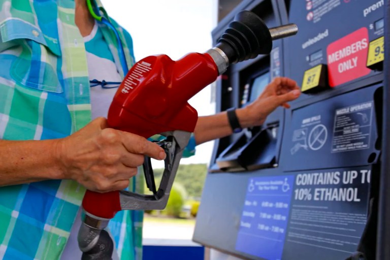 In this July 16, 2015, photo, a customer refuels her car at a Costco in Pittsburgh.