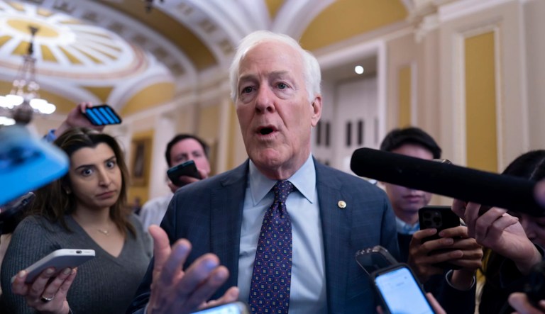 Sen. John Cornyn, R-Texas, is surrounded by reporters as he heads to the chamber during a test vote to begin debate on a border security bill, at the Capitol in Washington, Wednesday, Feb. 7, 2024. (AP Photo/J. Scott Applewhite)