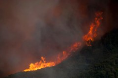 Wildfire east of LA threatens thousands of homes and forces evacuations