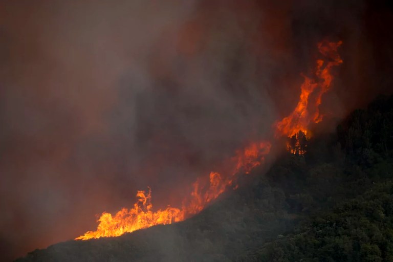 Wildfire east of LA threatens thousands of homes and forces evacuations