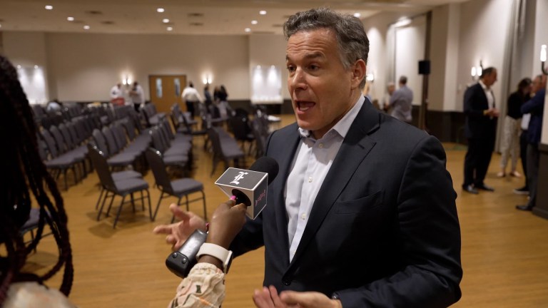 Dave McCormick in a synagogue speaking into a Washington Examiner microphone