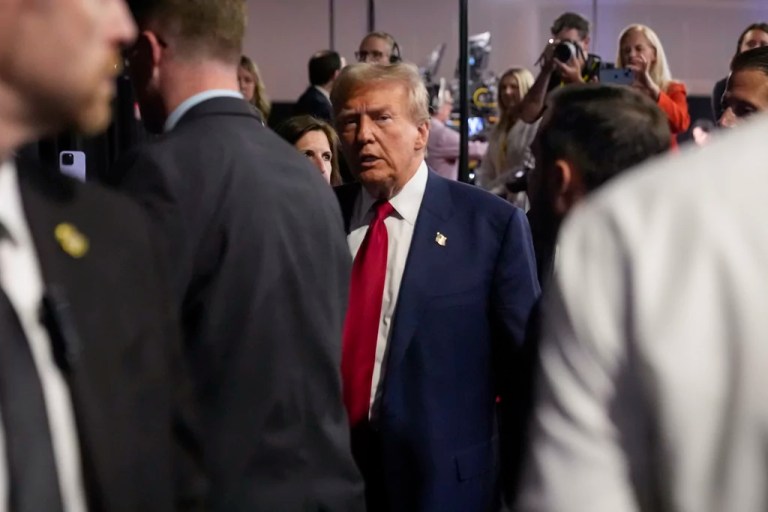 Trump makes rare spin room visit and suggests openness to a second debate