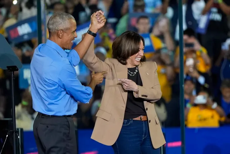 Former President Barrack Obama gestures to then-Democratic presidential nominee Vice President Kamala Harris after introducing her to speak during a campaign rally for Harris on Thursday, Oct. 24, 2024.