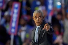Obama scolds heckler but stays silent on state of Democrats in return to spotlight
