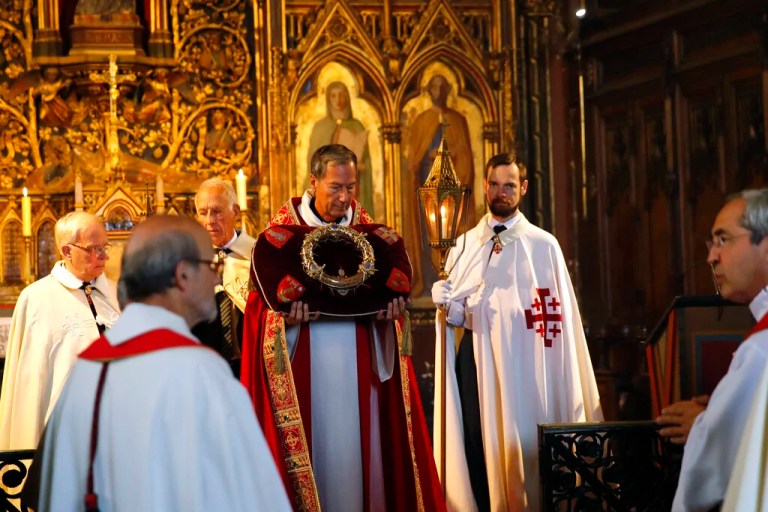 An ecclesiastic holds the Crown of Thorns relic during a ceremony in St Germain l'Auxerrois church, in Paris, Friday, Sept. 6, 2019.