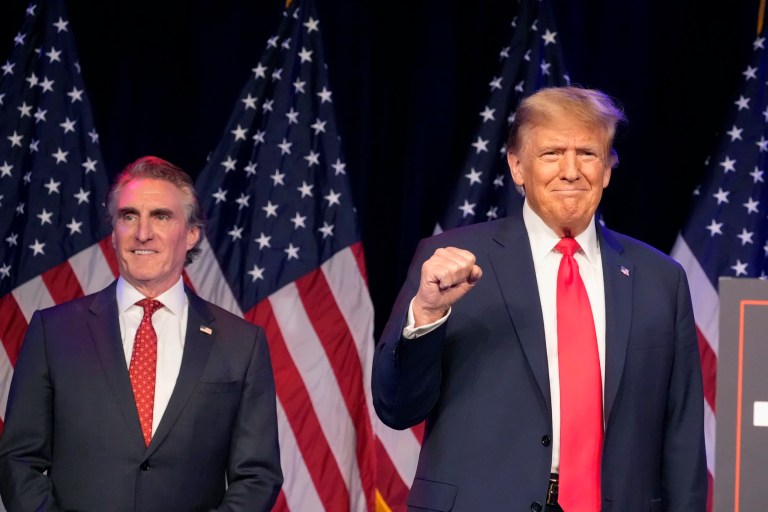 President-elect Donald Trump, right, and Gov. Doug Burgum (R-ND) attend a caucus night rally, Feb. 8, 2024, in Las Vegas.
