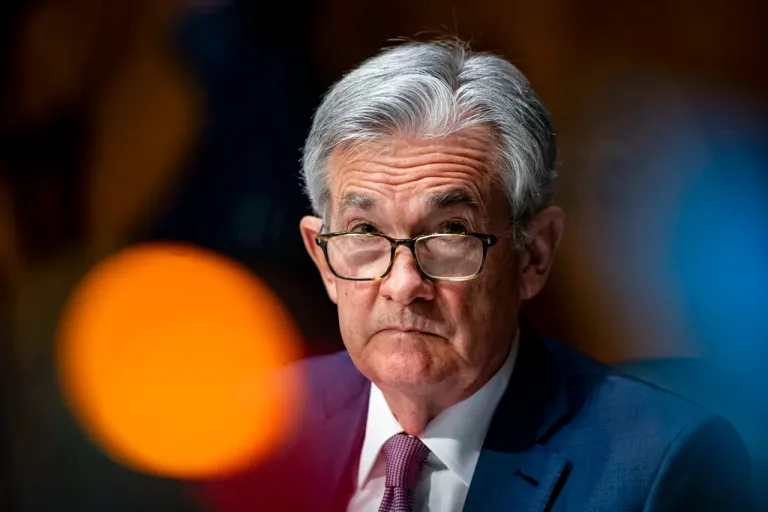 In this Dec. 1, 2020 file photo, Federal Reserve Chairman Jerome Powell listens during a Senate Banking Committee hearing on Capitol Hill in Washington. Federal Reserve officials were convinced last month that the U.S. economy and job growth had slowed as COVID-19 cases surged across the country. They noted that the economy's outlook is heavily dependent on the course of the virus.