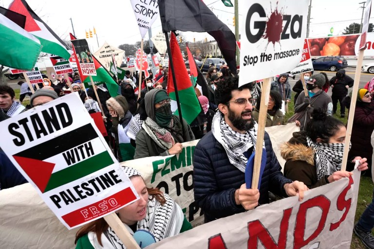 Pro-Palestinian demonstrators march during a visit by President Joe Biden in Warren, Mich., Feb. 1, 2024.