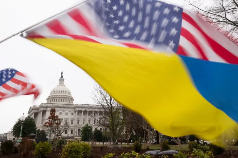 Ukraine sympathizers fly a Ukrainian flag outside.