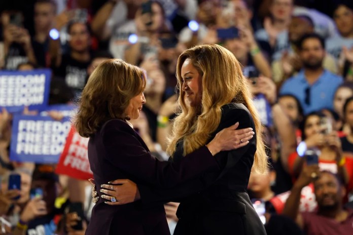 Musical artist Beyonce, right, and Democratic presidential nominee Vice President Kamala Harris, left, embrace on stage during a campaign rally Friday, Oct. 25, 2024, in Houston.