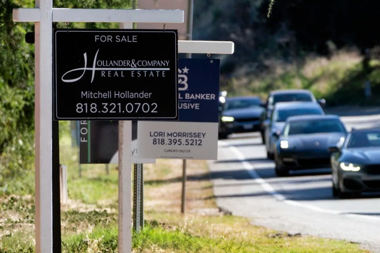 Home sale signs are posted along Topanga Canyon road in Los Angeles, Thursday, Oct. 19, 2023.