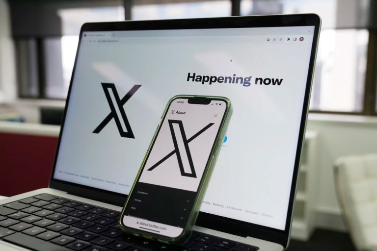 The opening page of X is displayed on a computer and phone, Oct. 16, 2023, in Sydney. The social media platform X says it will now allow people to show consensual adult content, as long as it is clearly labeled as such. The move formalizes a policy already in place when the platform was known as Twitter, before billionaire Elon Musk purchased it in 2022.