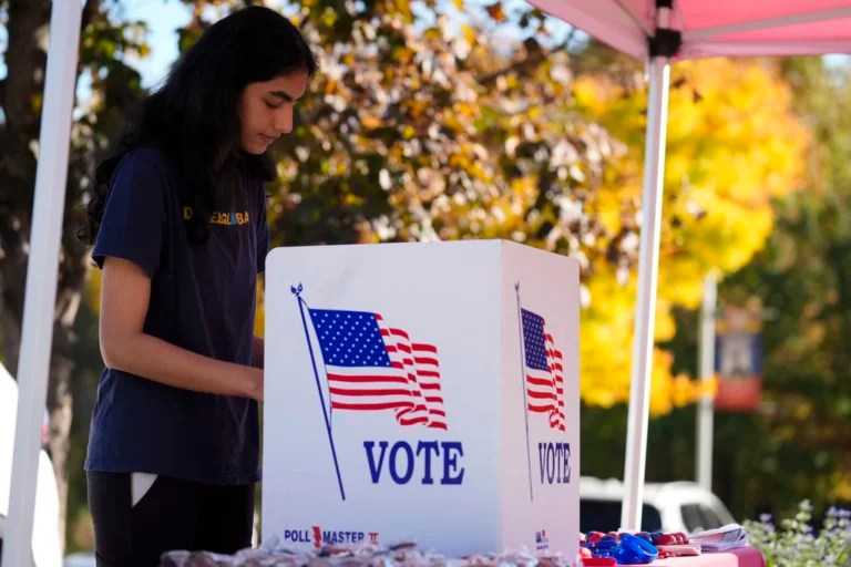 Shreya Srinivasan fills out her mail-in ballot at a Montgomery County voter services mobile location in King of Prussia, Pennsylvania, Tuesday, Oct. 22, 2024.