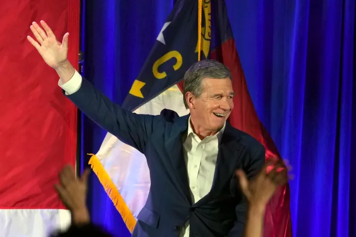 Gov. Roy Cooper (D-NC) waves to supporters.